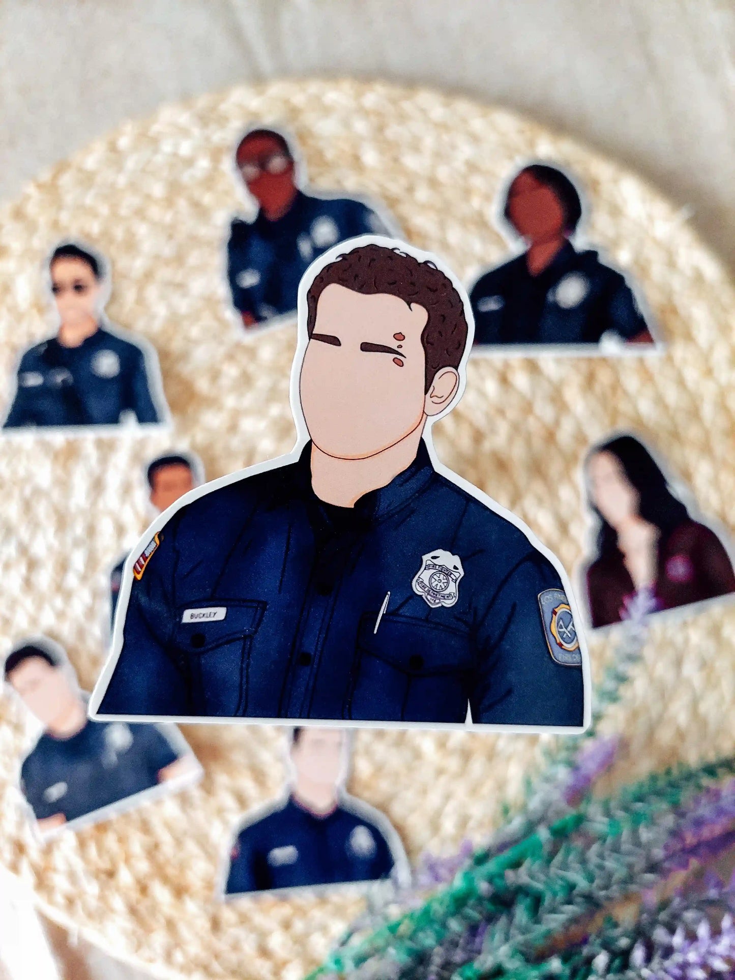 Close up photo of a vinyl sticker inspired by 9-1-1, featuring Buck.