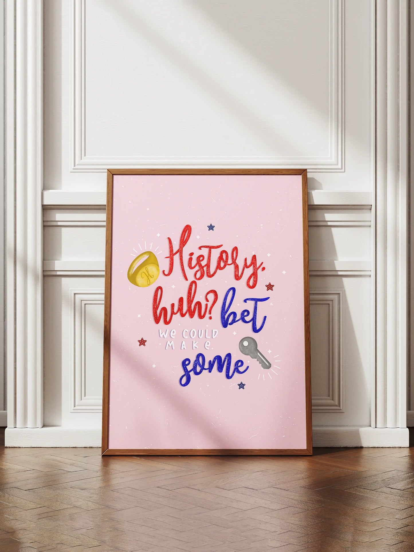 Art print inspired by Red, White and Royal Blue, featuring a pink background with the quote "History, huh? Bet we could make some" and small ring and key illustrations.