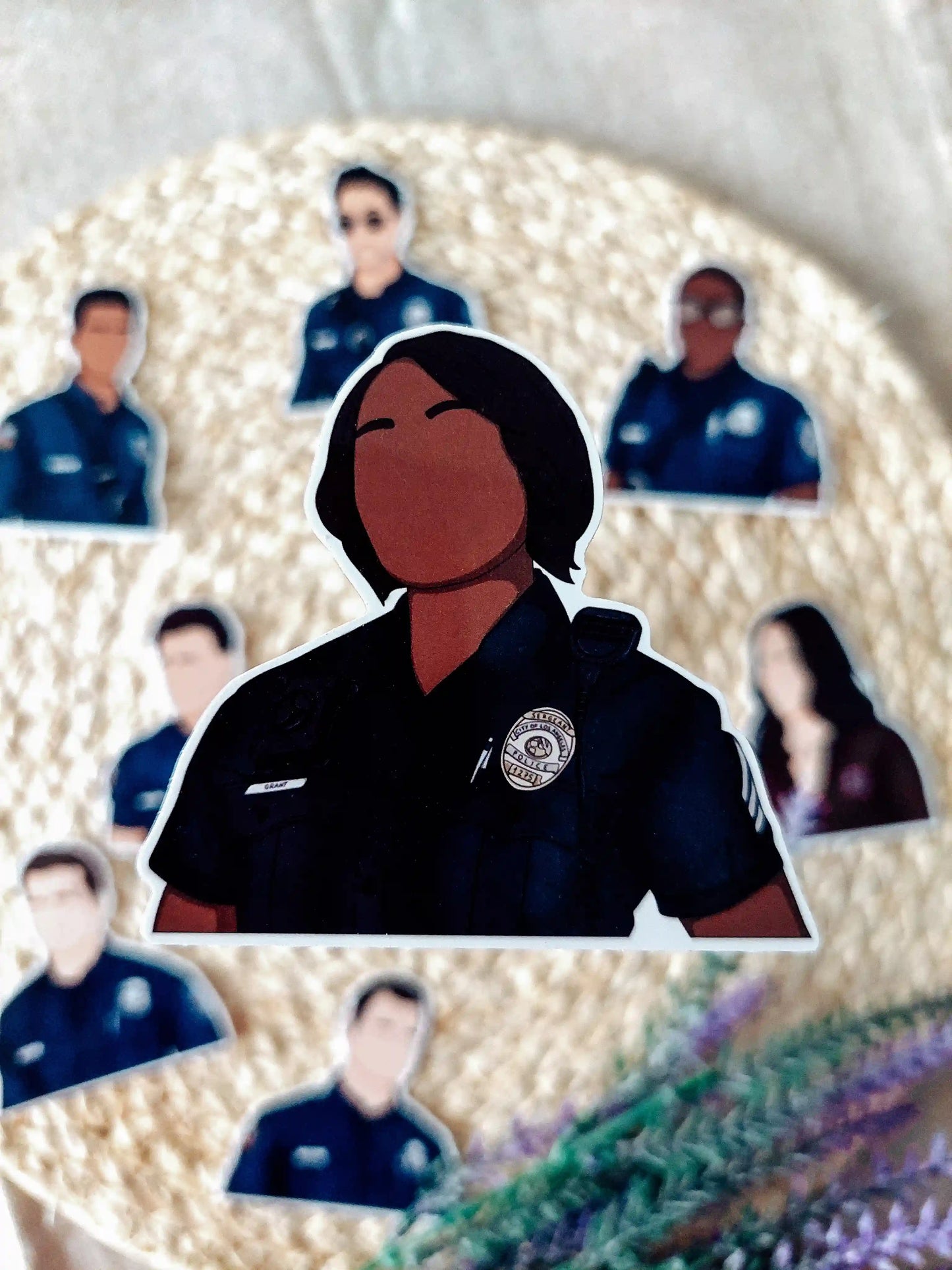 Close up photo of a vinyl sticker inspired by 9-1-1, featuring Athena Grant.
