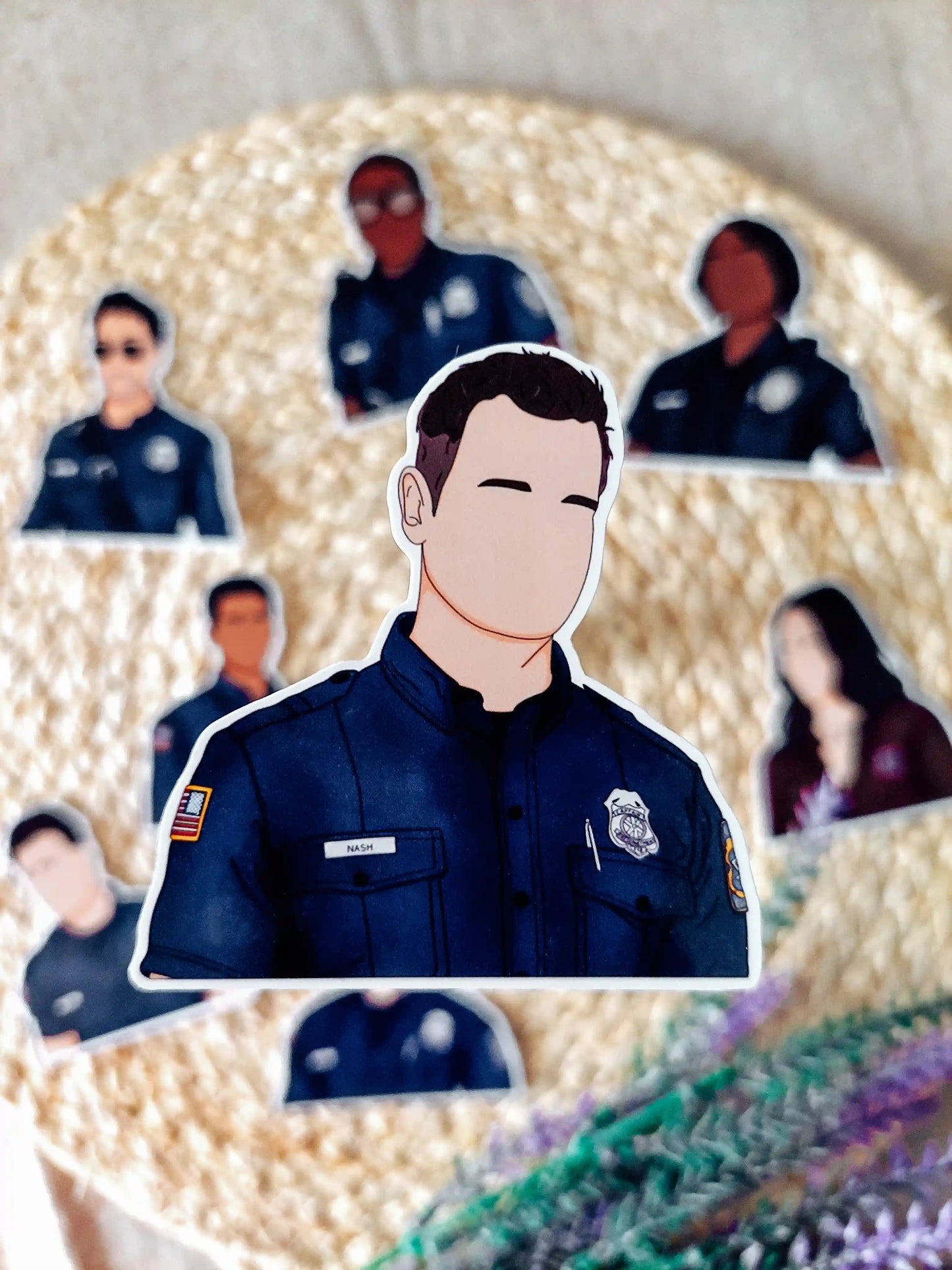 Close up photo of a vinyl sticker inspired by 9-1-1, featuring Bobby Nash.