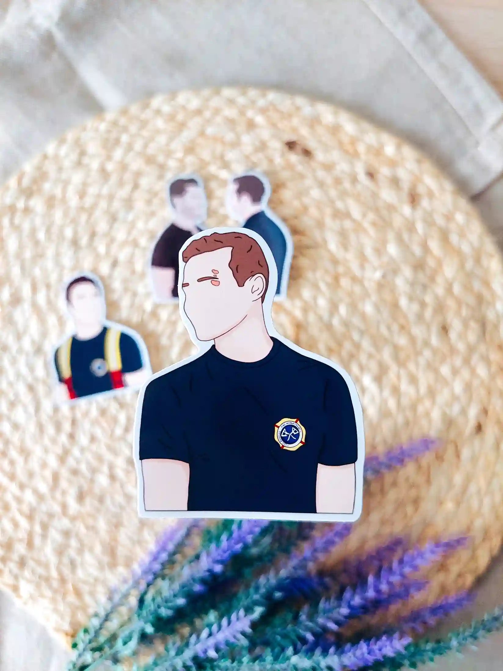 Close up photo of a vinyl sticker inspired by 9-1-1, featuring Buck.