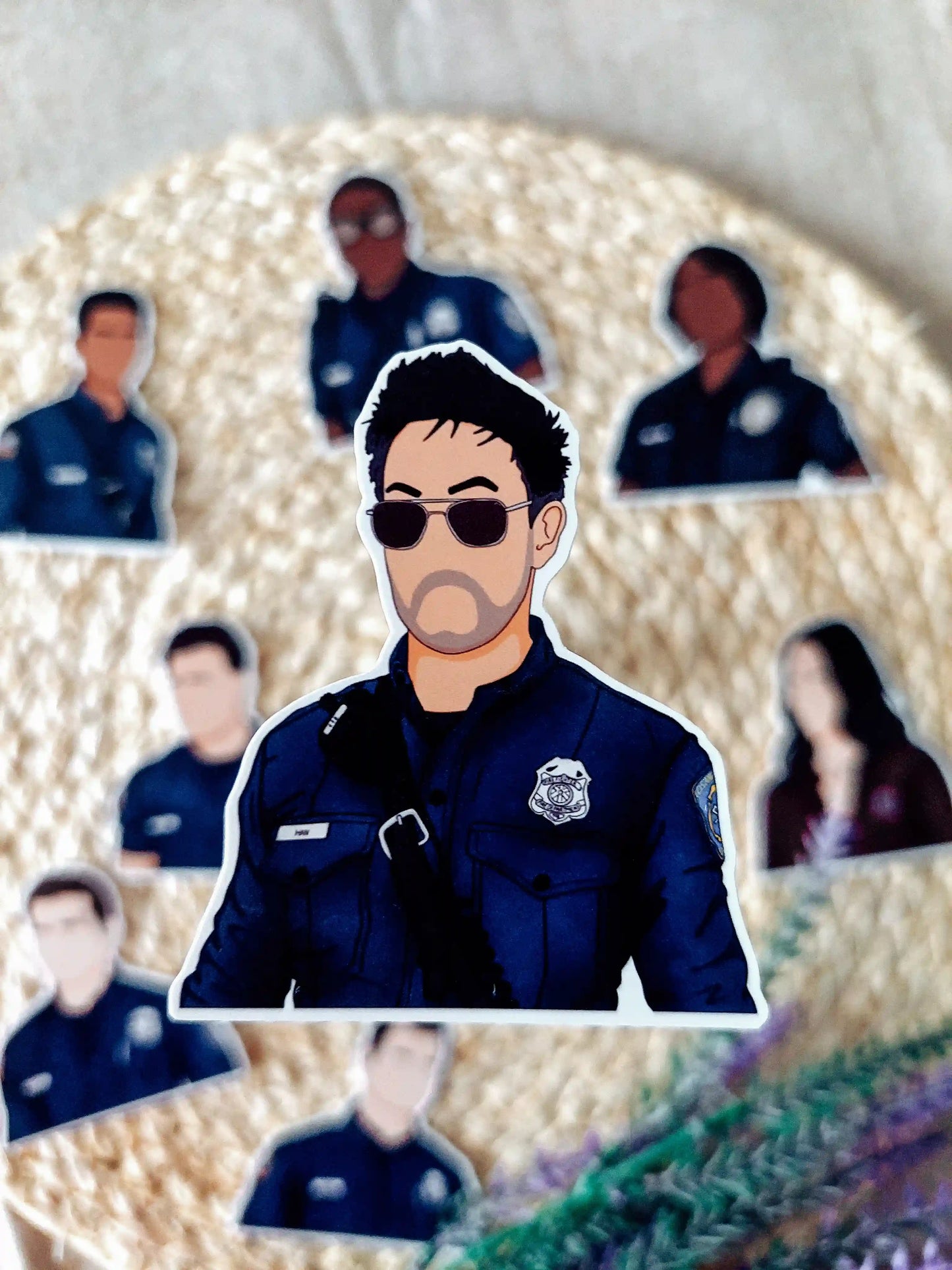 Close up photo of a vinyl sticker inspired by 9-1-1, featuring Chimney.