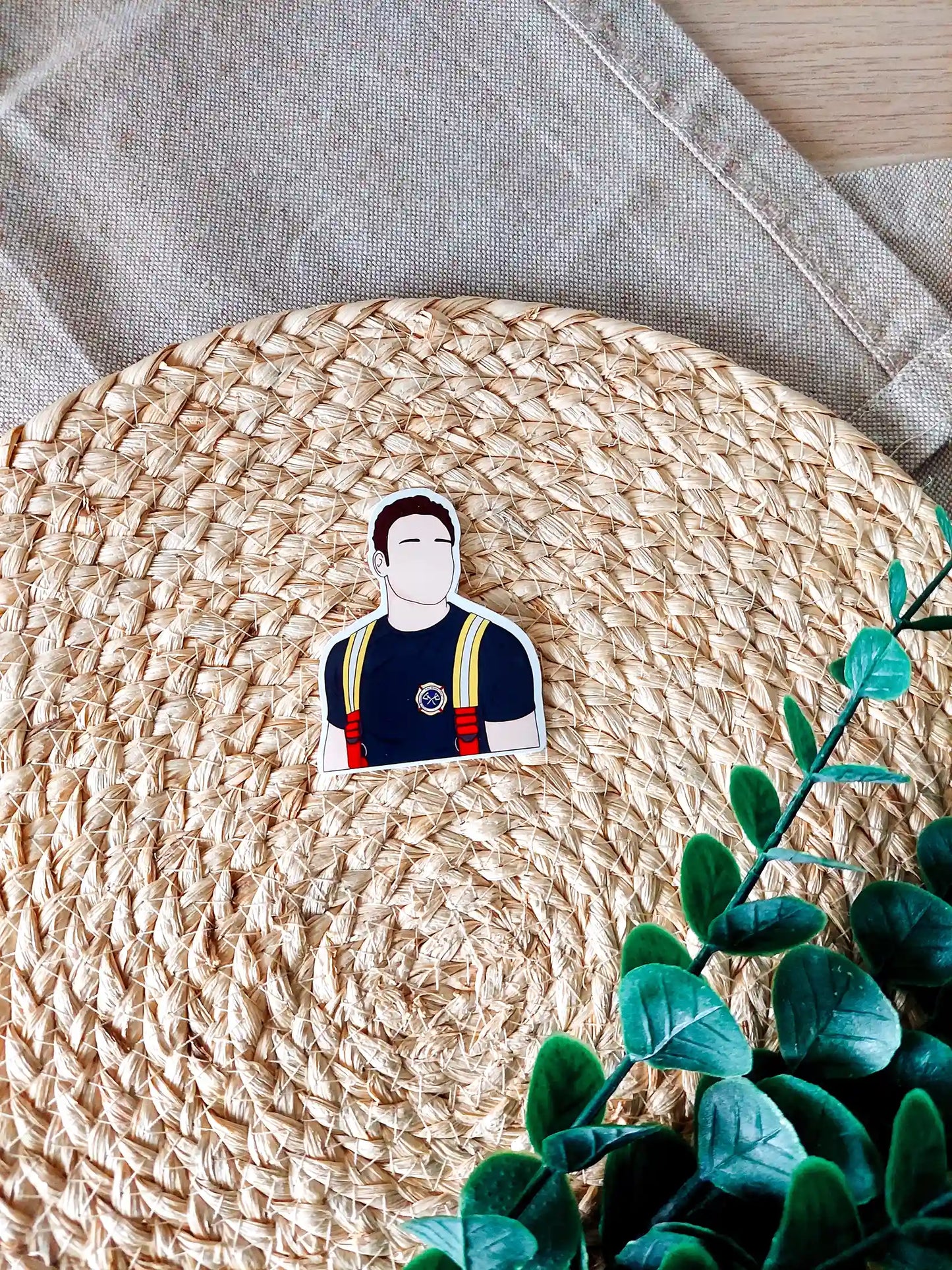 Close up photo of a vinyl sticker inspired by 9-1-1, featuring Eddie Diaz.