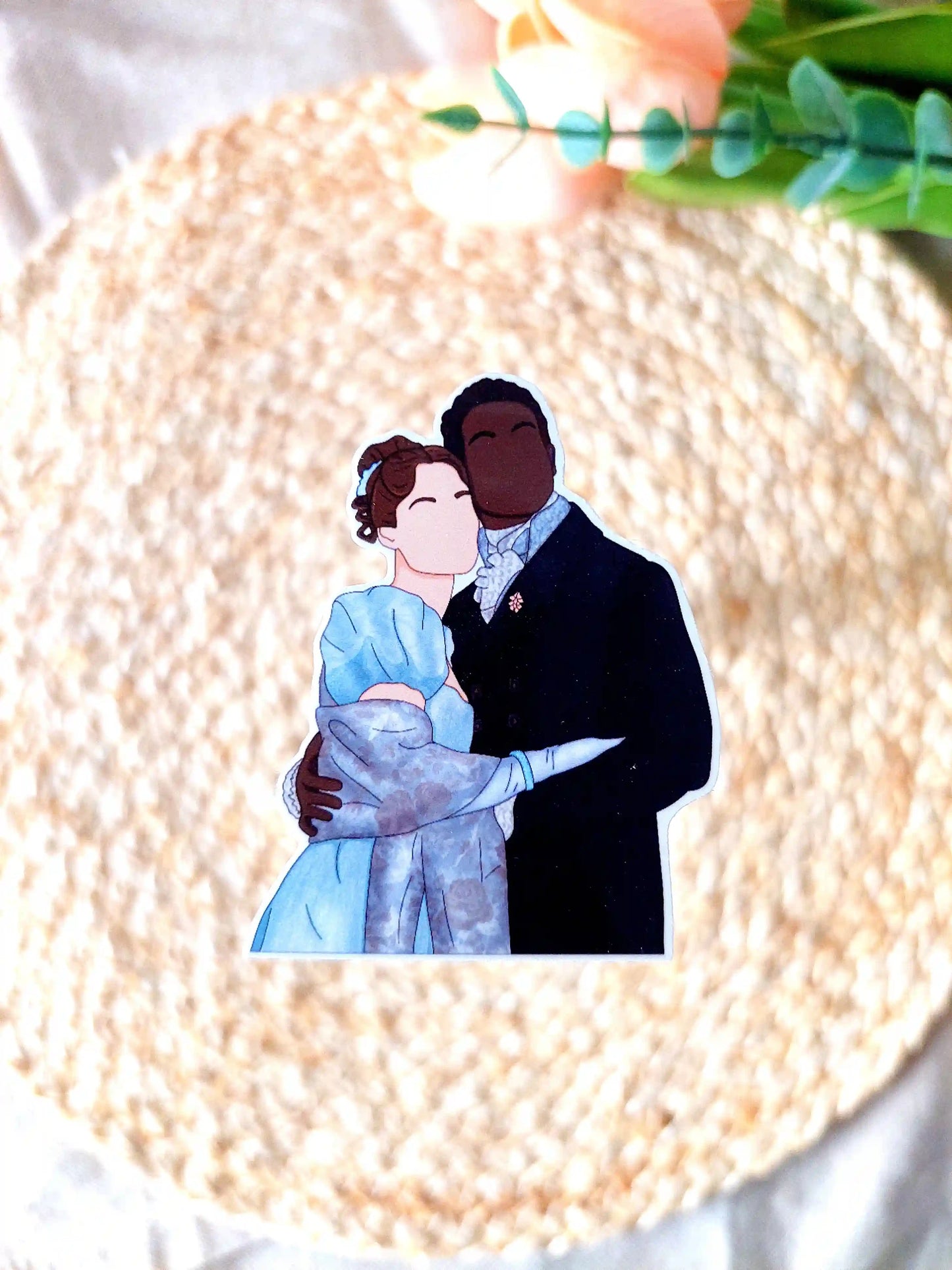 Close up photo of a vinyl sticker inspired by Bridgerton, featuring Francesca and John.