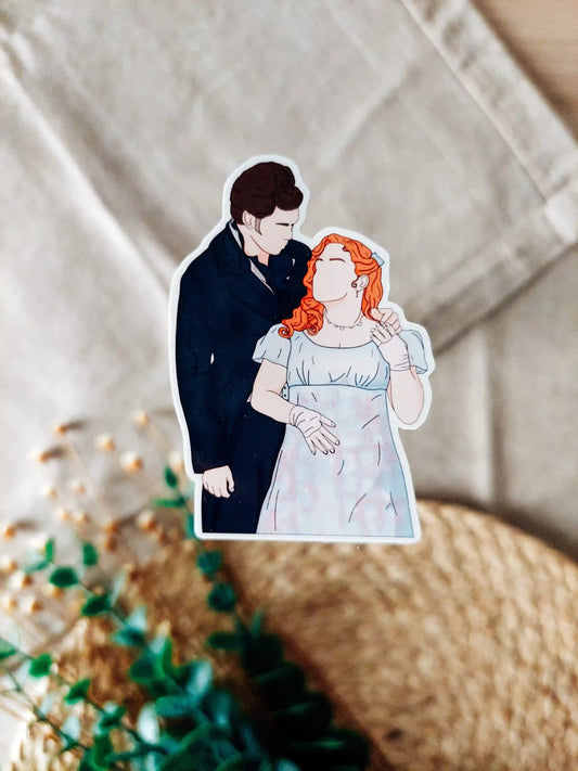Close up photo of a vinyl sticker inspired by Bridgerton, featuring Penelope and Colin.