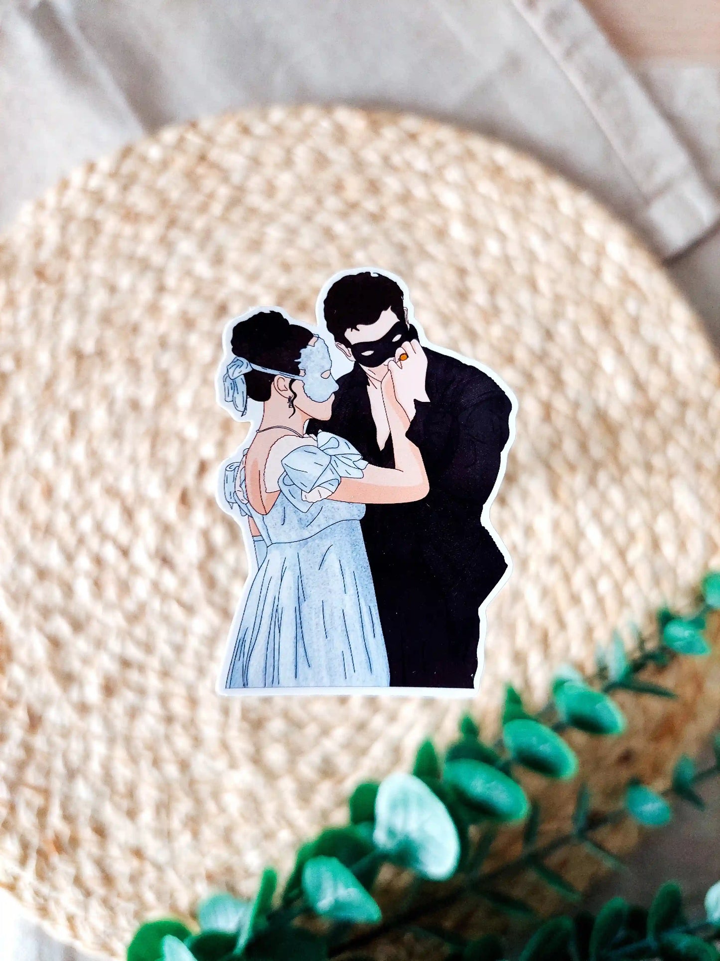 Close up photo of a vinyl sticker inspired by Bridgerton, featuring Sophie and Benedict.
