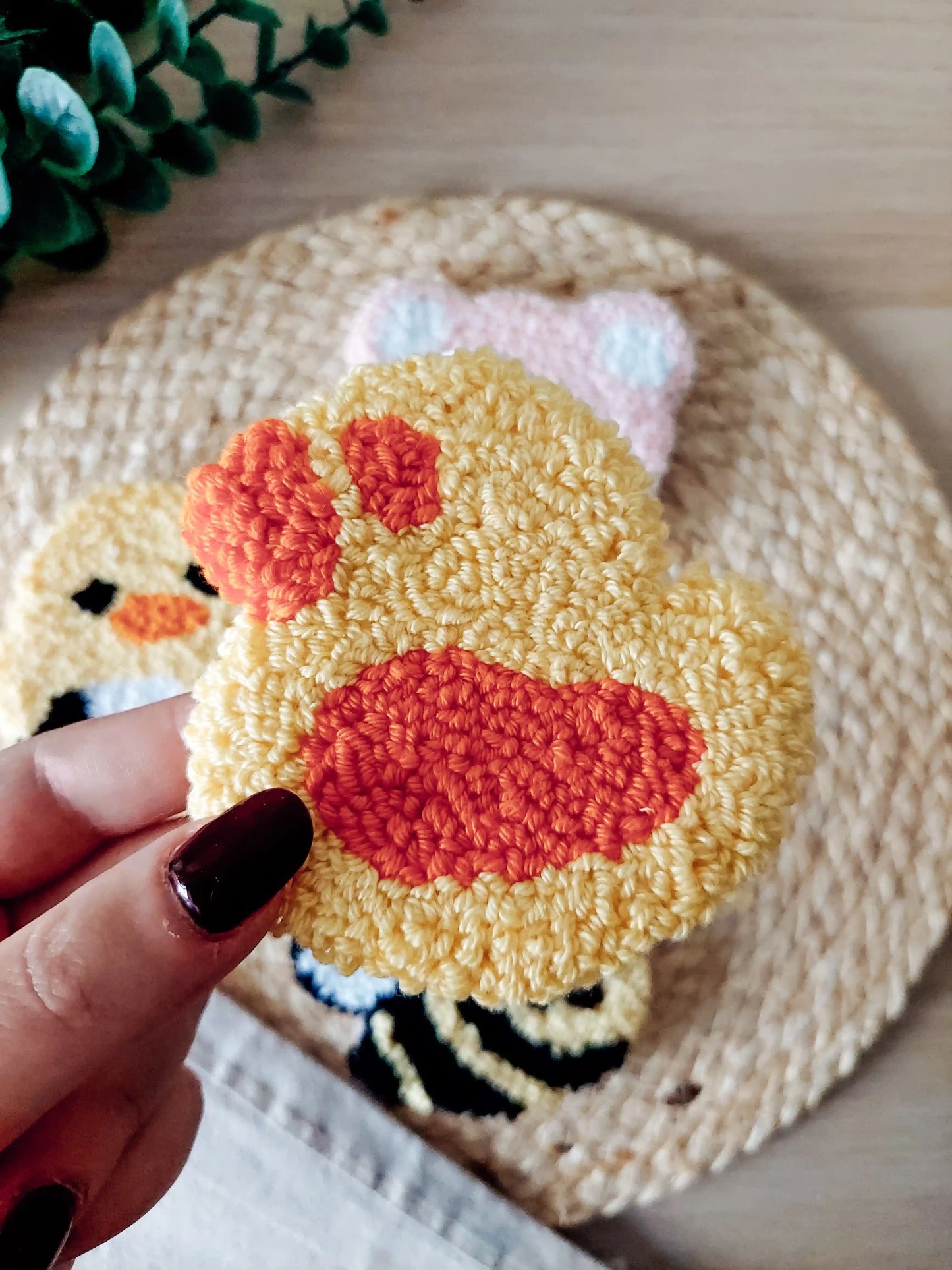 Handmade punch needle coaster, featuring a cute yellow and orange duck.