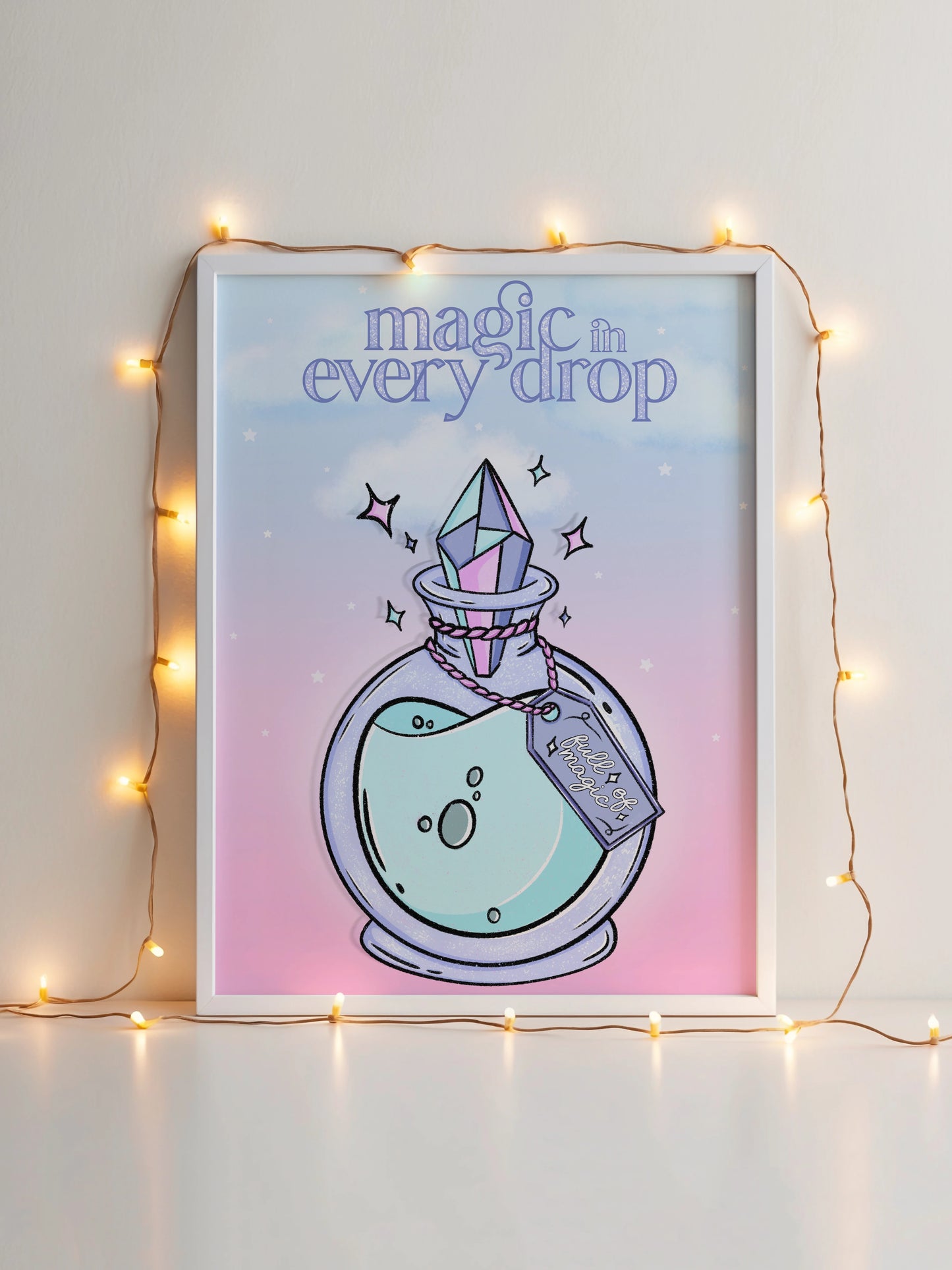 Art print featuring an illustrated potion bottle with a crystal stopper and the phrase "Magic in Every Drop" displayed in a frame with decorative lights.
