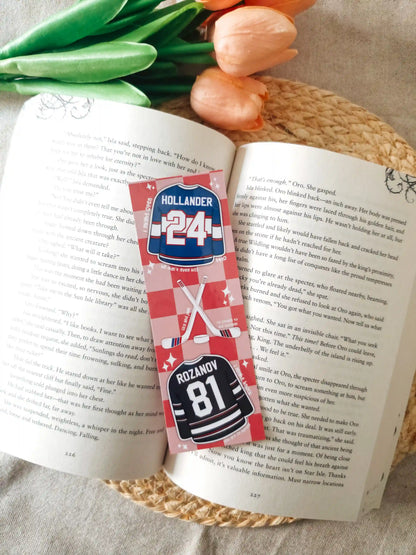 Glossy laminated bookmark featuring Hollander #24 blue jersey and Rozanov #81 black jersey with crossed hockey sticks, a puck and quotes scattered on a red checkered background.