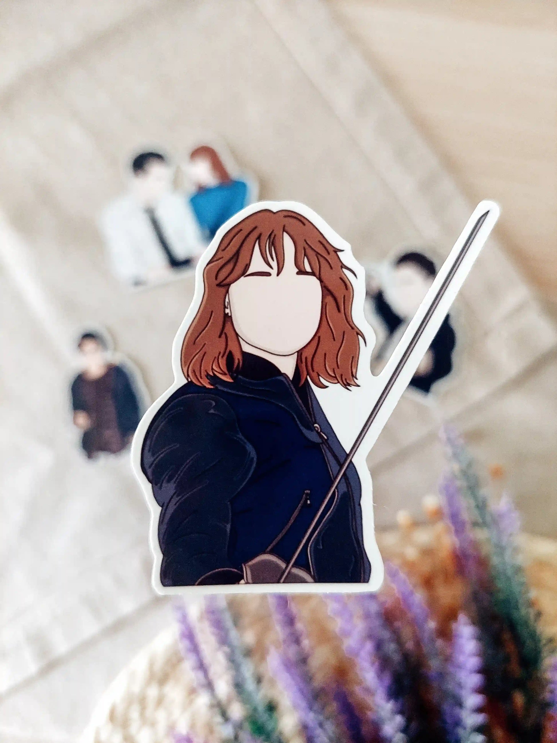 Close up photo of a vinyl sticker inspired by Lockwood & Co, featuring Lucy Carlyle