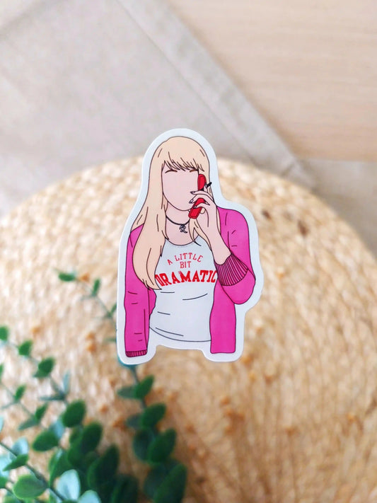 Close up photo of a vinyl sticker inspired by Mean Girls, featuring Regina George.