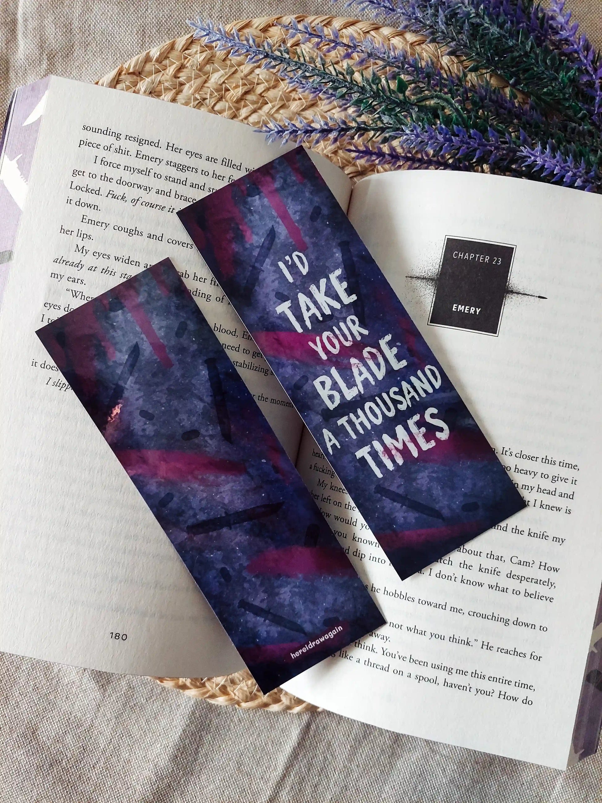 My Blade, Your Back inspired bookmarks displayed on an open book, featuring a purple and pink background with dagger illustrations and the quote "I'd take your blade a thousand times".