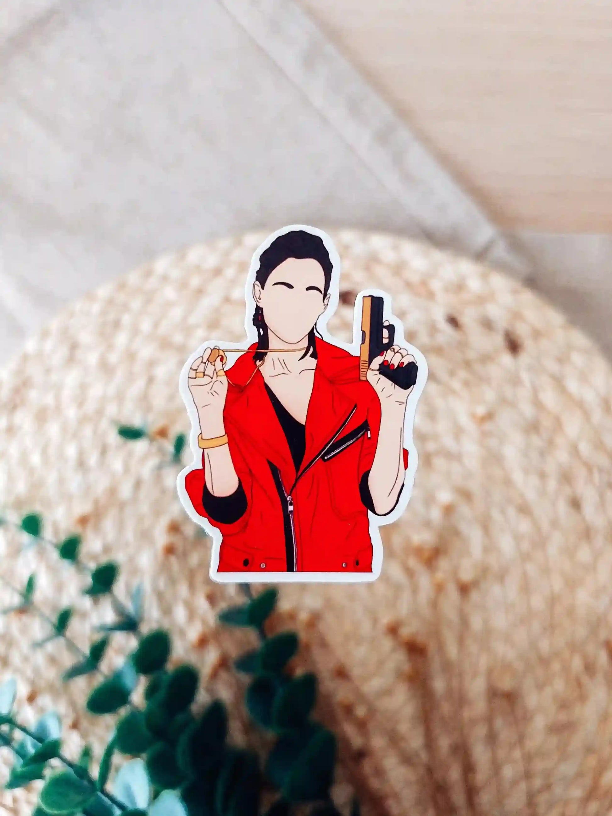 Close up photo of a vinyl sticker inspired by La Casa de Papel, featuring Nairobi.