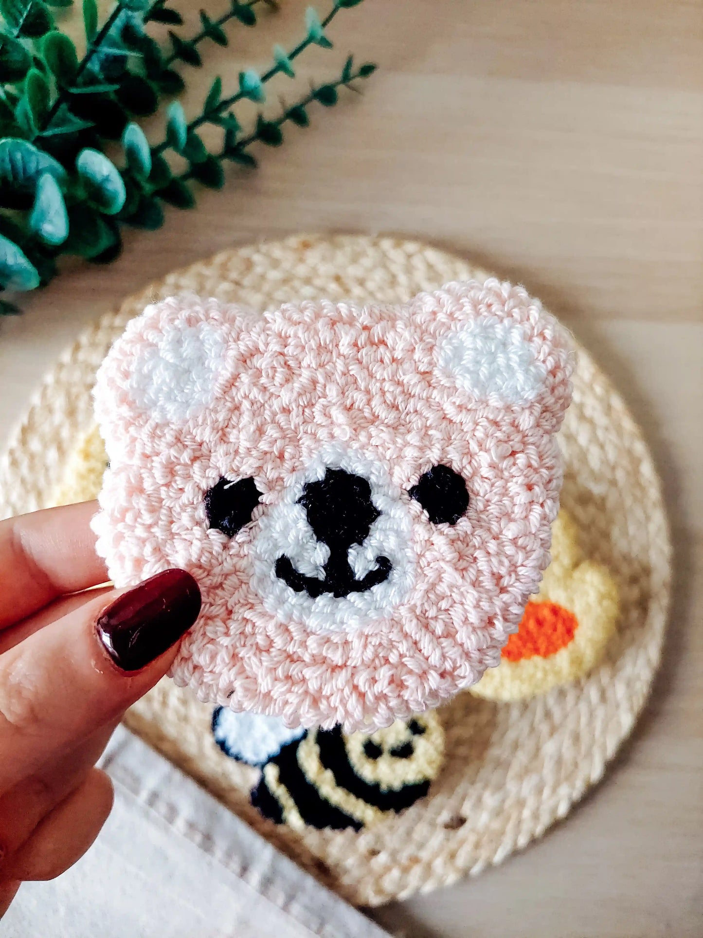 Handmade punch needle coaster, featuring a cute pink bear.