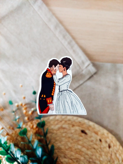 Close up photo of a vinyl sticker inspired by Queen Charlotte, featuring Charlotte and King George.
