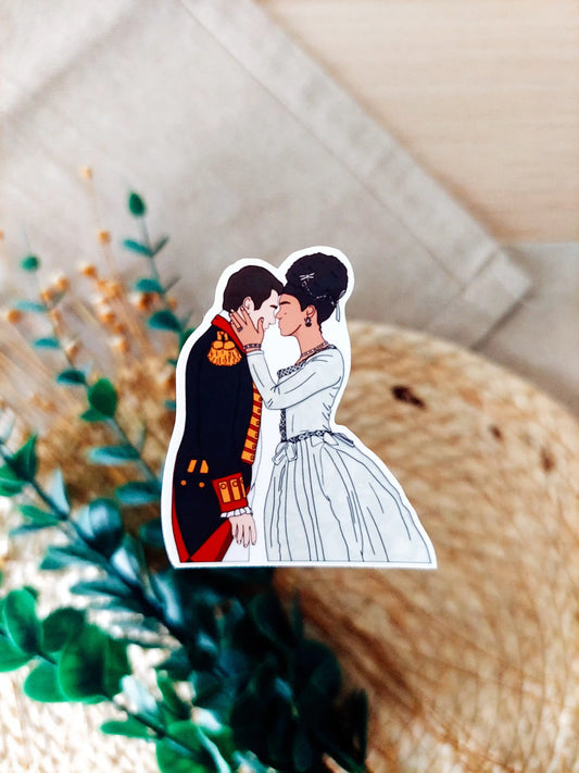 Close up photo of a vinyl sticker inspired by Queen Charlotte, featuring Charlotte and King George.