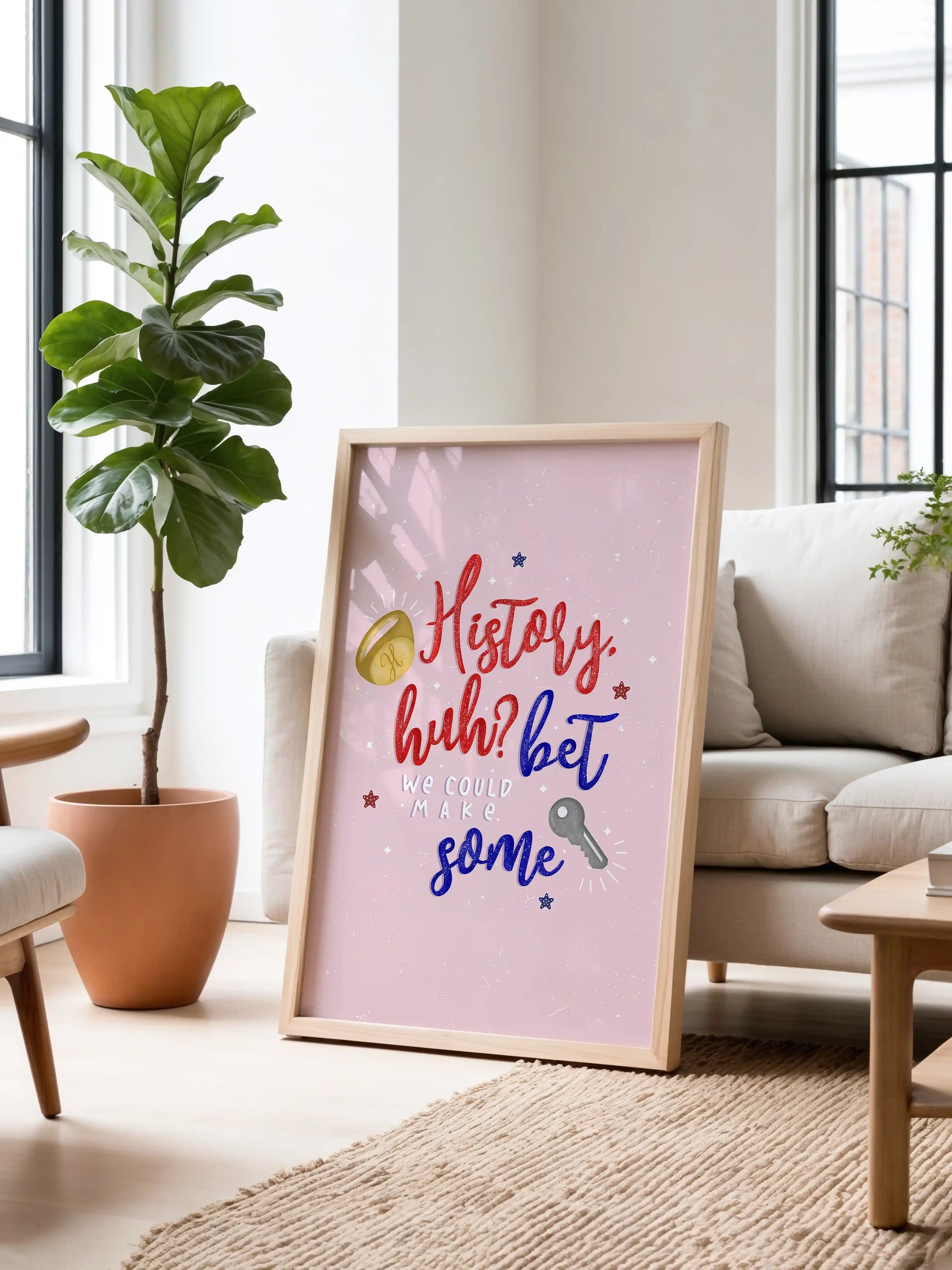 Art print inspired by Red, White and Royal Blue, featuring a pink background with the quote "History, huh? Bet we could make some" and small ring and key illustrations.