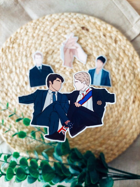 Close up photo of a vinyl sticker inspired by Red, White and Royal Blue, featuring Alex and Henry.
