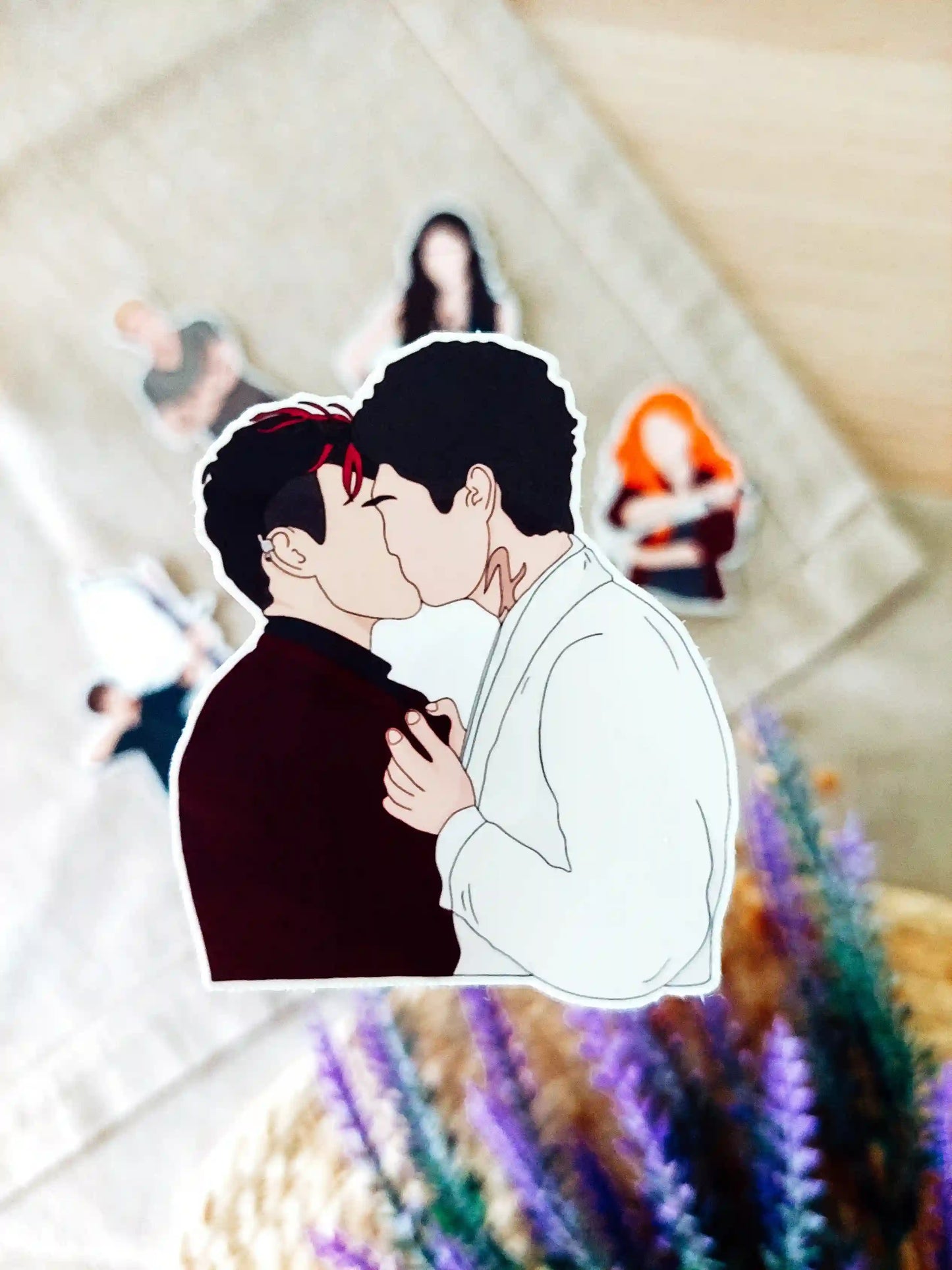 Close up photo of a vinyl sticker inspired by Shadowhunters, featuring Alec Lightwood and Magnus Bane.
