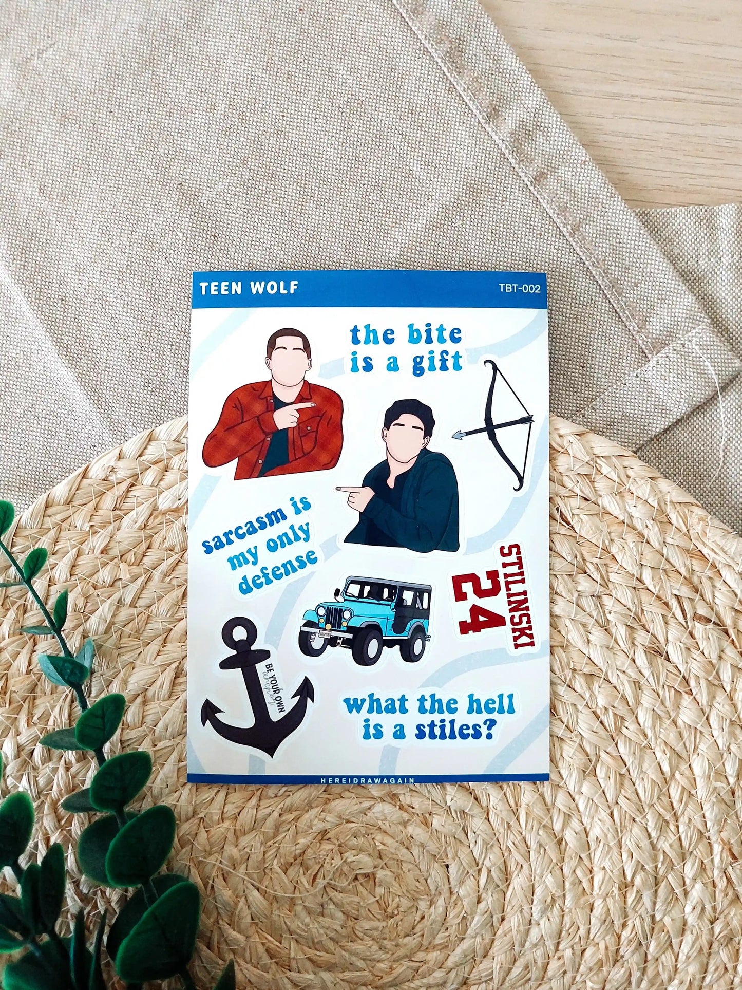 Teen Wolf themed sticker sheet featuring iconic symbols, quotes and details from the show, photographed on a woven mat.