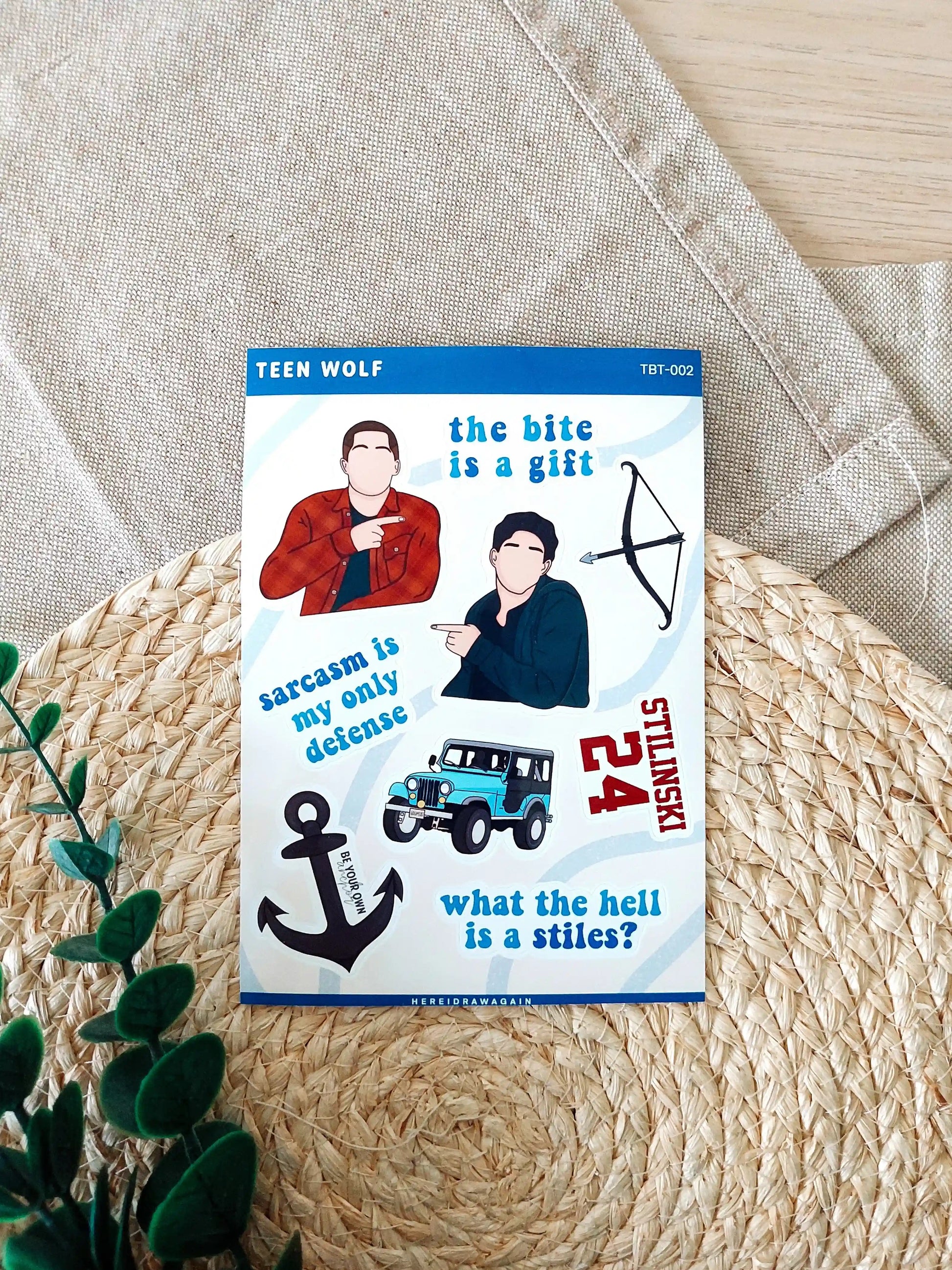 Teen Wolf themed sticker sheet featuring iconic symbols, quotes and details from the show, photographed on a woven mat.
