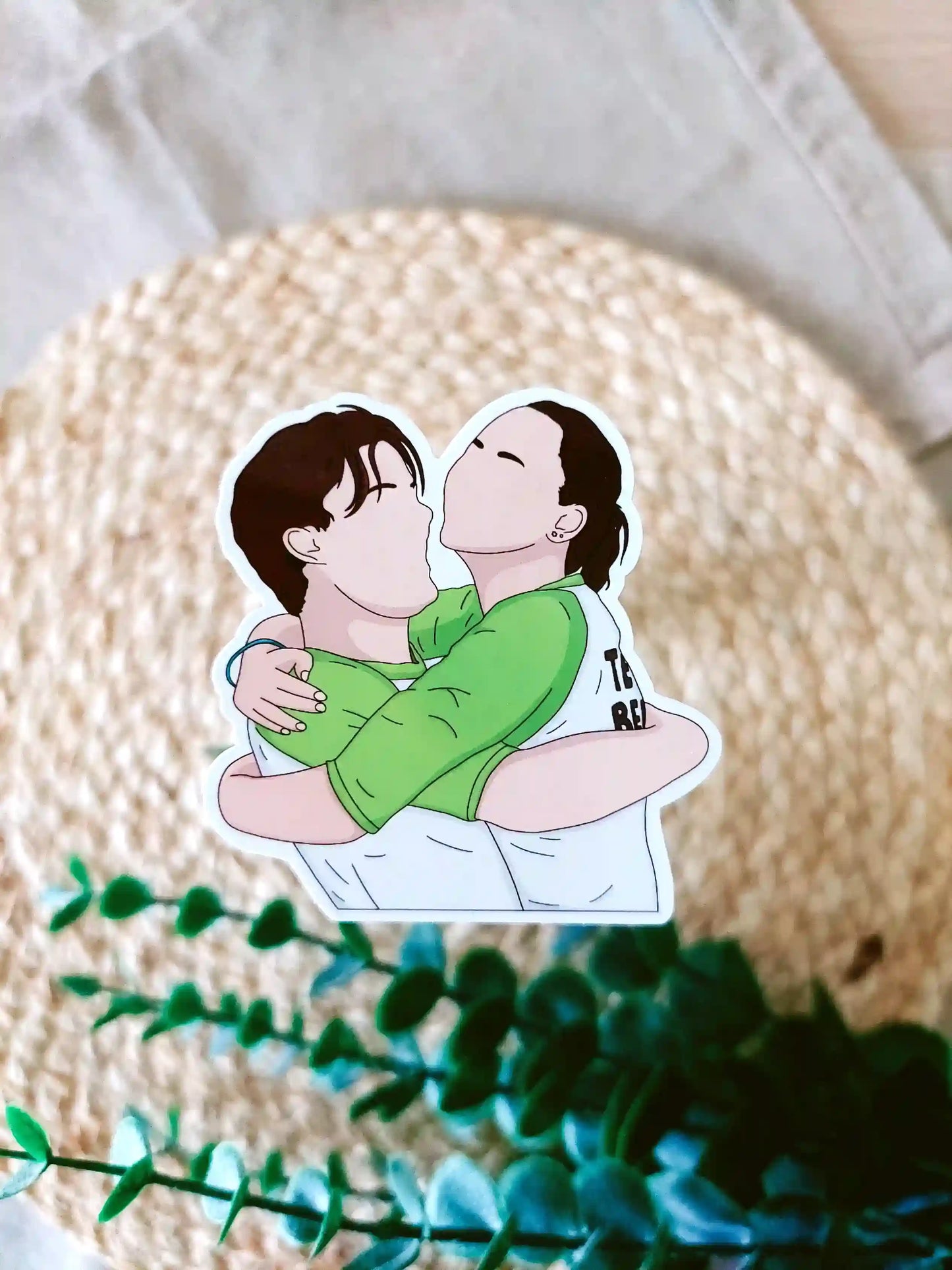 Close up photo of a vinyl sticker inspired by The Summer I Turned Pretty, featuring Belly and Conrad.